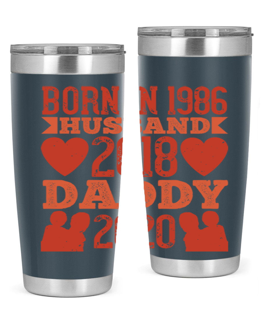 A stylish 'Born in Husband Daddy' tumbler in stainless steel, showcasing its double wall vacuum design and drink-thru lid.