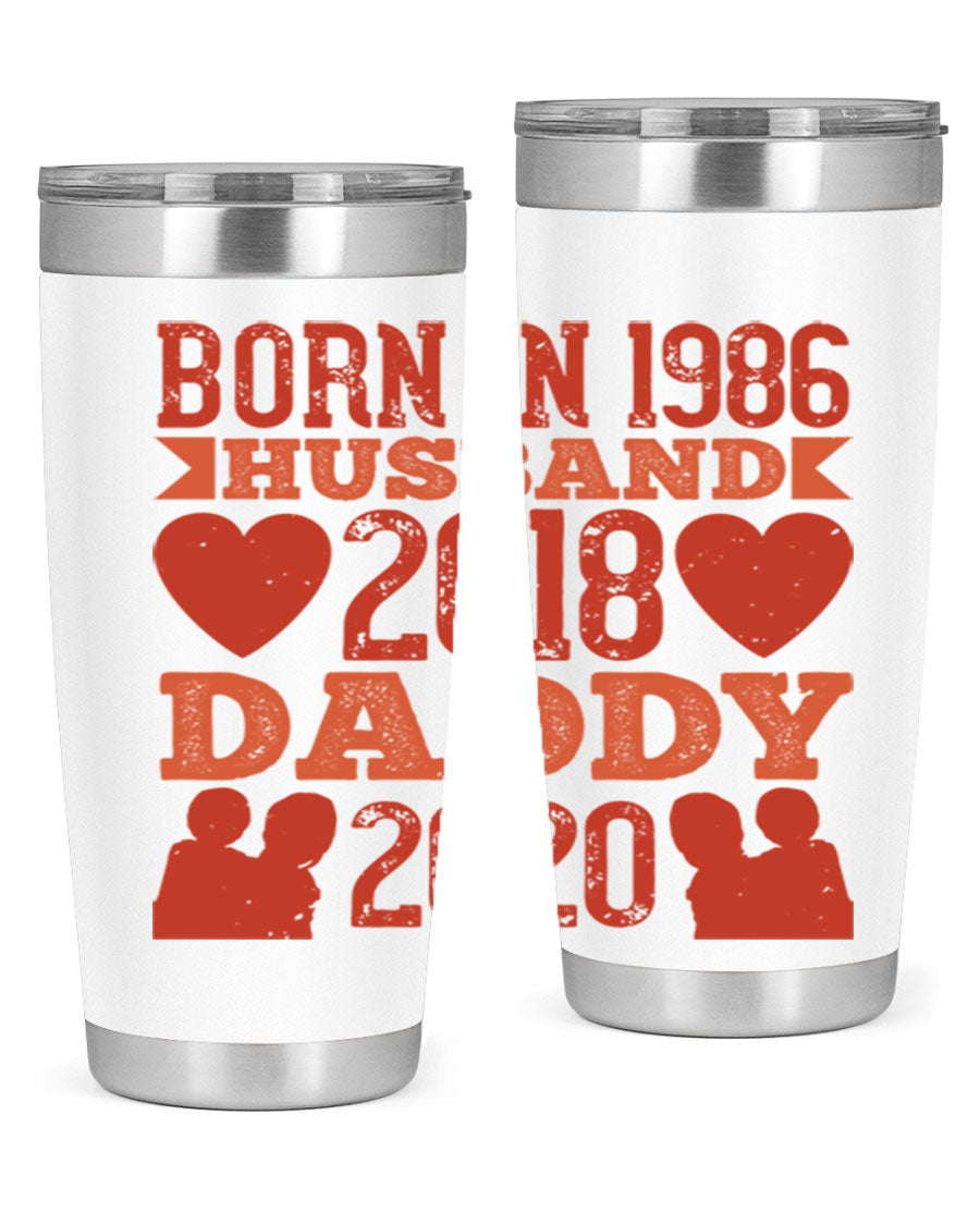 A stylish 'Born in Husband Daddy' tumbler in stainless steel, showcasing its double wall vacuum design and drink-thru lid.