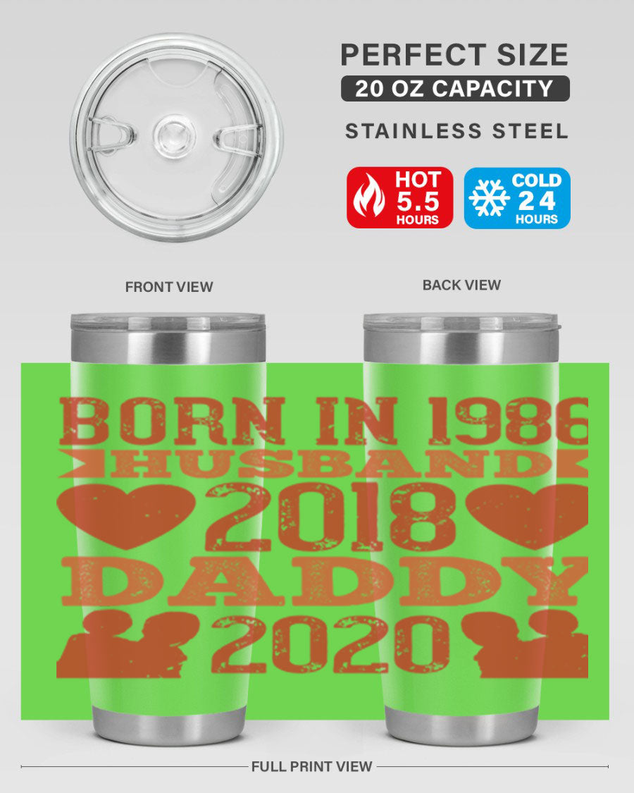 A stylish 'Born in Husband Daddy' tumbler in stainless steel, showcasing its double wall vacuum design and drink-thru lid.