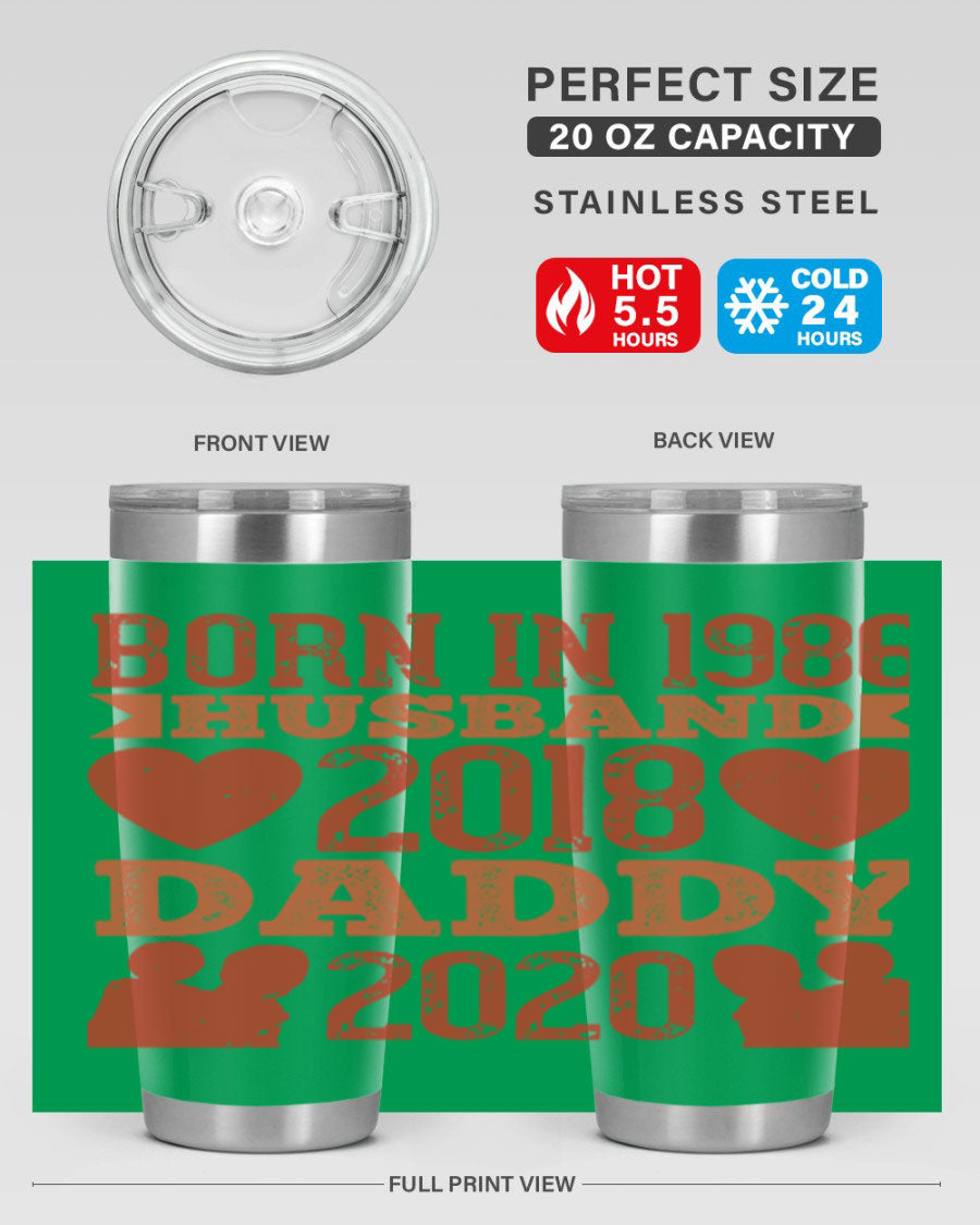 A stylish 'Born in Husband Daddy' tumbler in stainless steel, showcasing its double wall vacuum design and drink-thru lid.