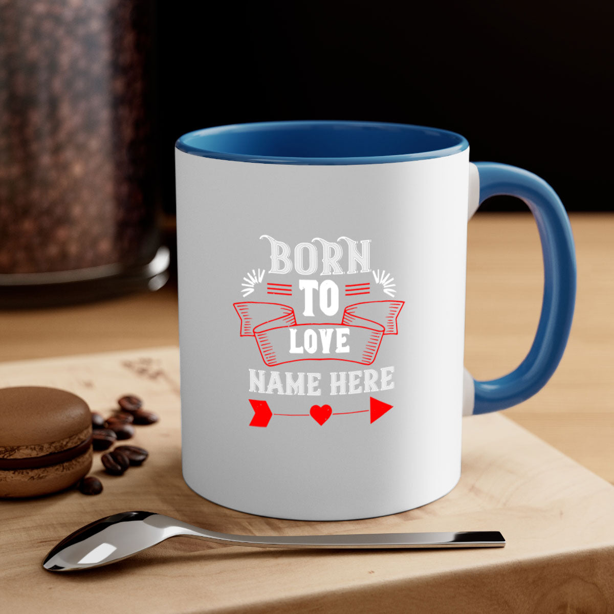 A stylish two-tone 'Born to Love' mug with a colored handle and glossy finish, perfect for Valentine's Day.