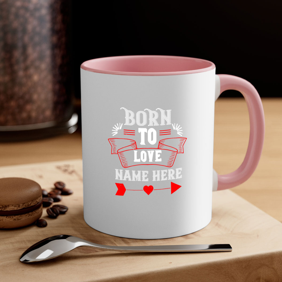 A stylish two-tone 'Born to Love' mug with a colored handle and glossy finish, perfect for Valentine's Day.