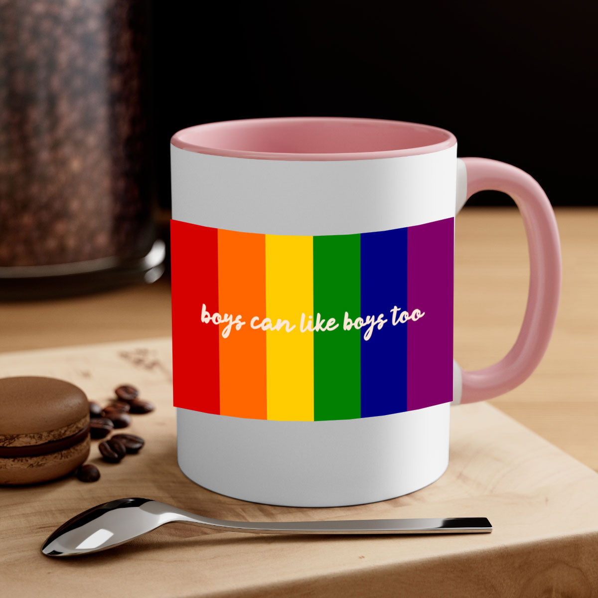 A stylish two-tone ceramic mug with the phrase 'Boys can like Boys too' in vibrant colors, featuring a colored handle and glossy finish.