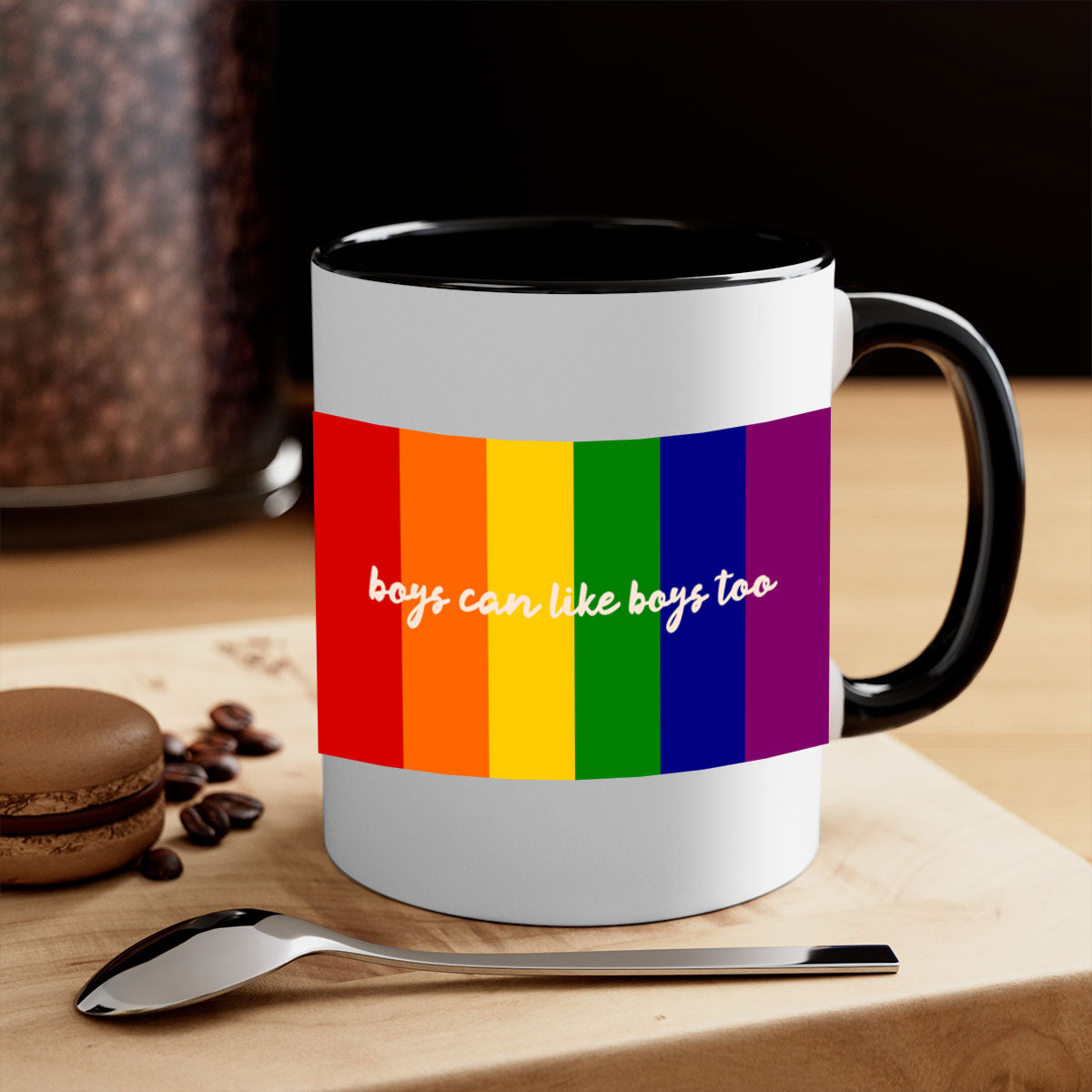 A stylish two-tone ceramic mug with the phrase 'Boys can like Boys too' in vibrant colors, featuring a colored handle and glossy finish.