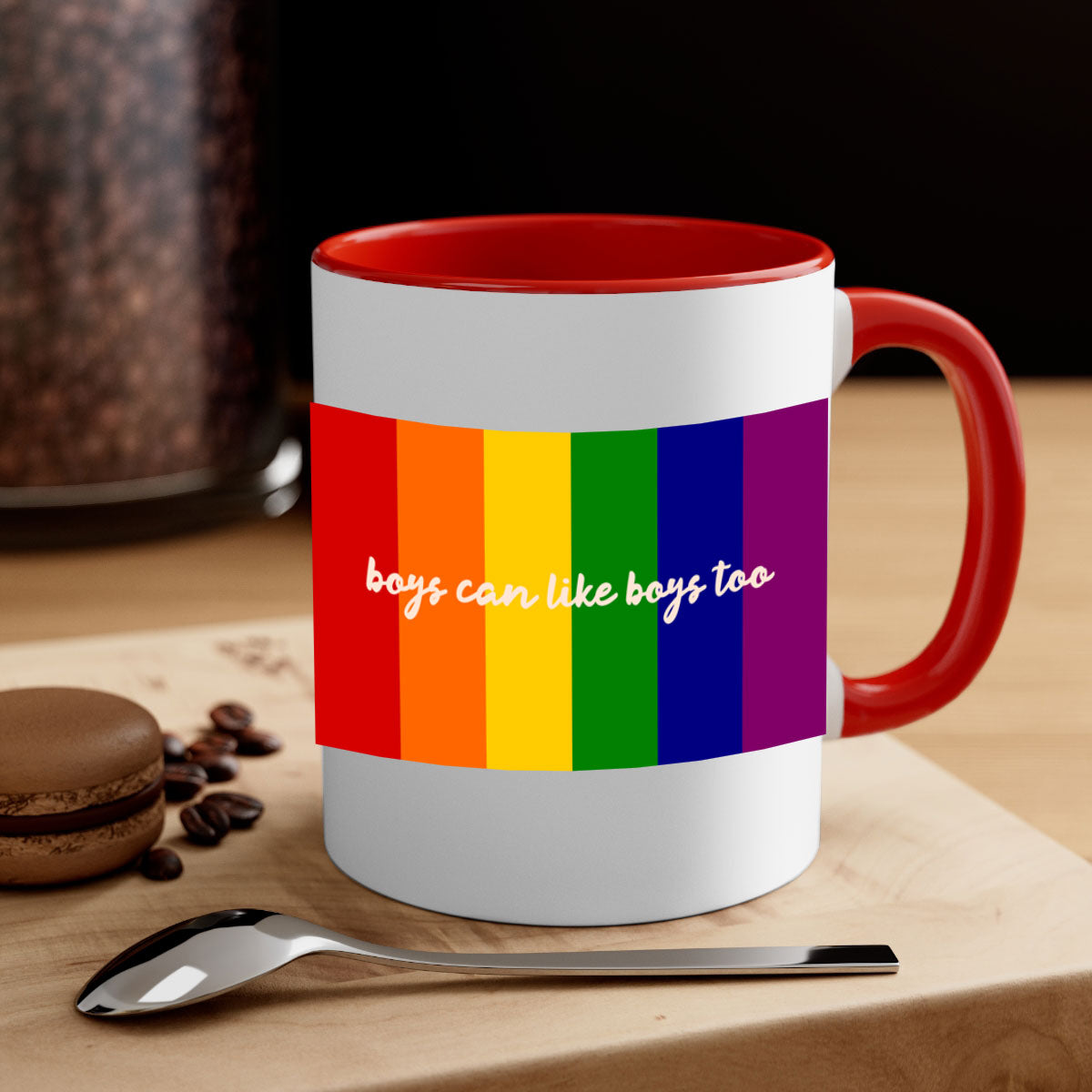 A stylish two-tone ceramic mug with the phrase 'Boys can like Boys too' in vibrant colors, featuring a colored handle and glossy finish.