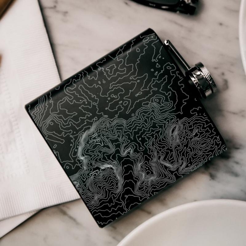 Matte black hip flask featuring a custom engraved map of Bryce Canyon National Park, Utah, with coordinates.