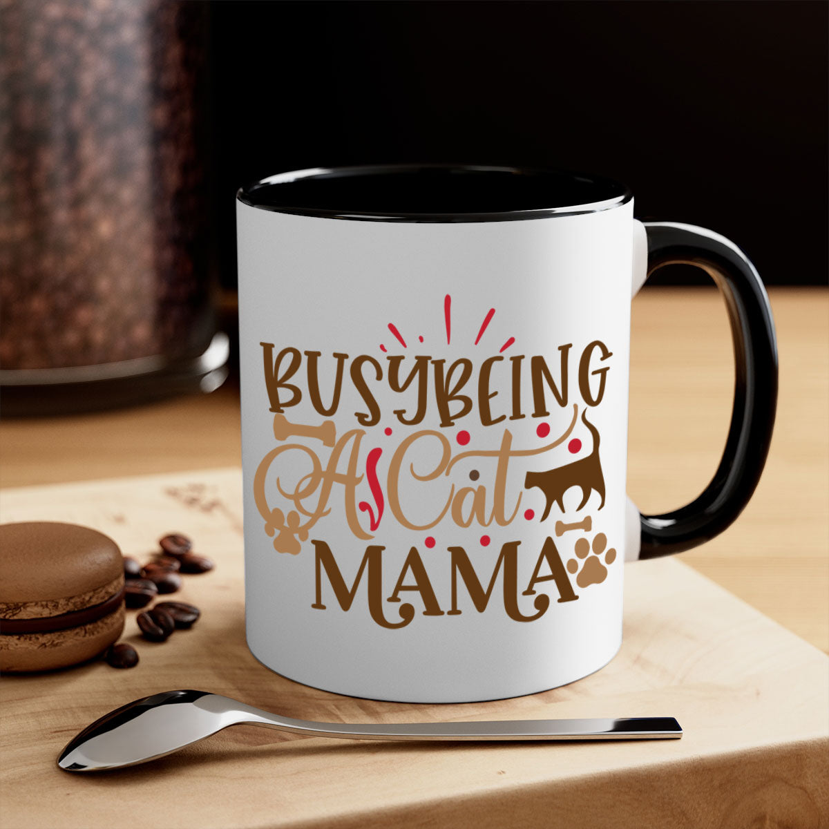 A stylish two-tone ceramic mug with a colored handle and interior, featuring the phrase 'Busy Being A Cat Mama' in a glossy finish.