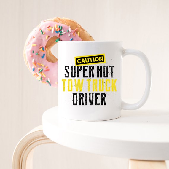 Caution Super Hot Tow Truck Driver funny coffee mug with a humorous design, perfect for coffee lovers and tow truck enthusiasts.