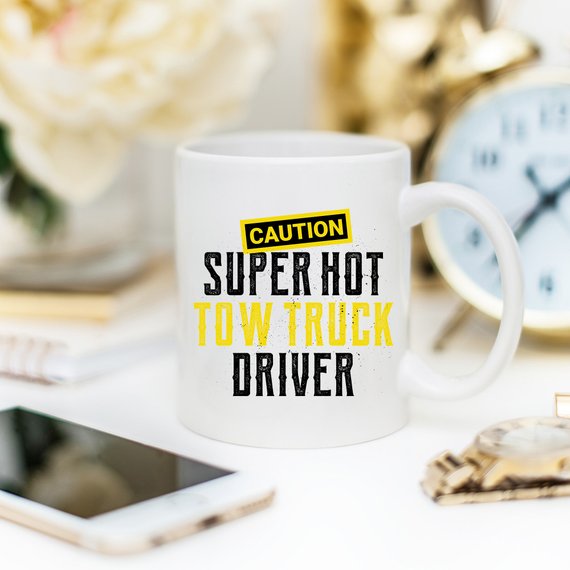 Caution Super Hot Tow Truck Driver funny coffee mug with a humorous design, perfect for coffee lovers and tow truck enthusiasts.