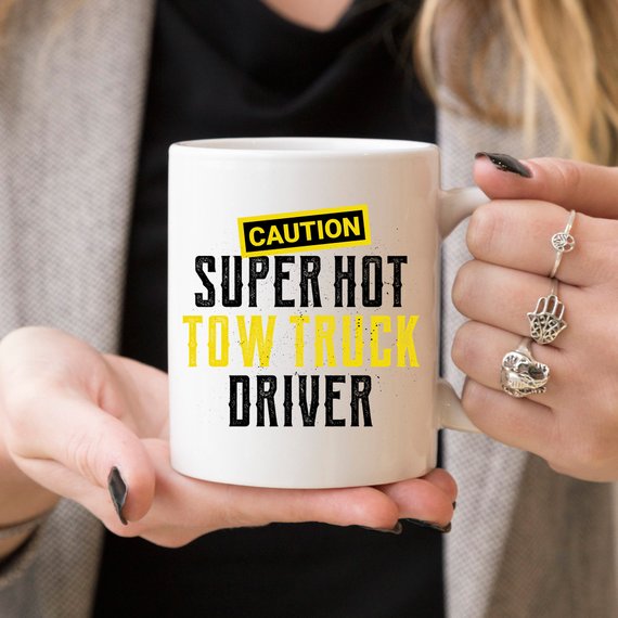 Caution Super Hot Tow Truck Driver funny coffee mug with a humorous design, perfect for coffee lovers and tow truck enthusiasts.