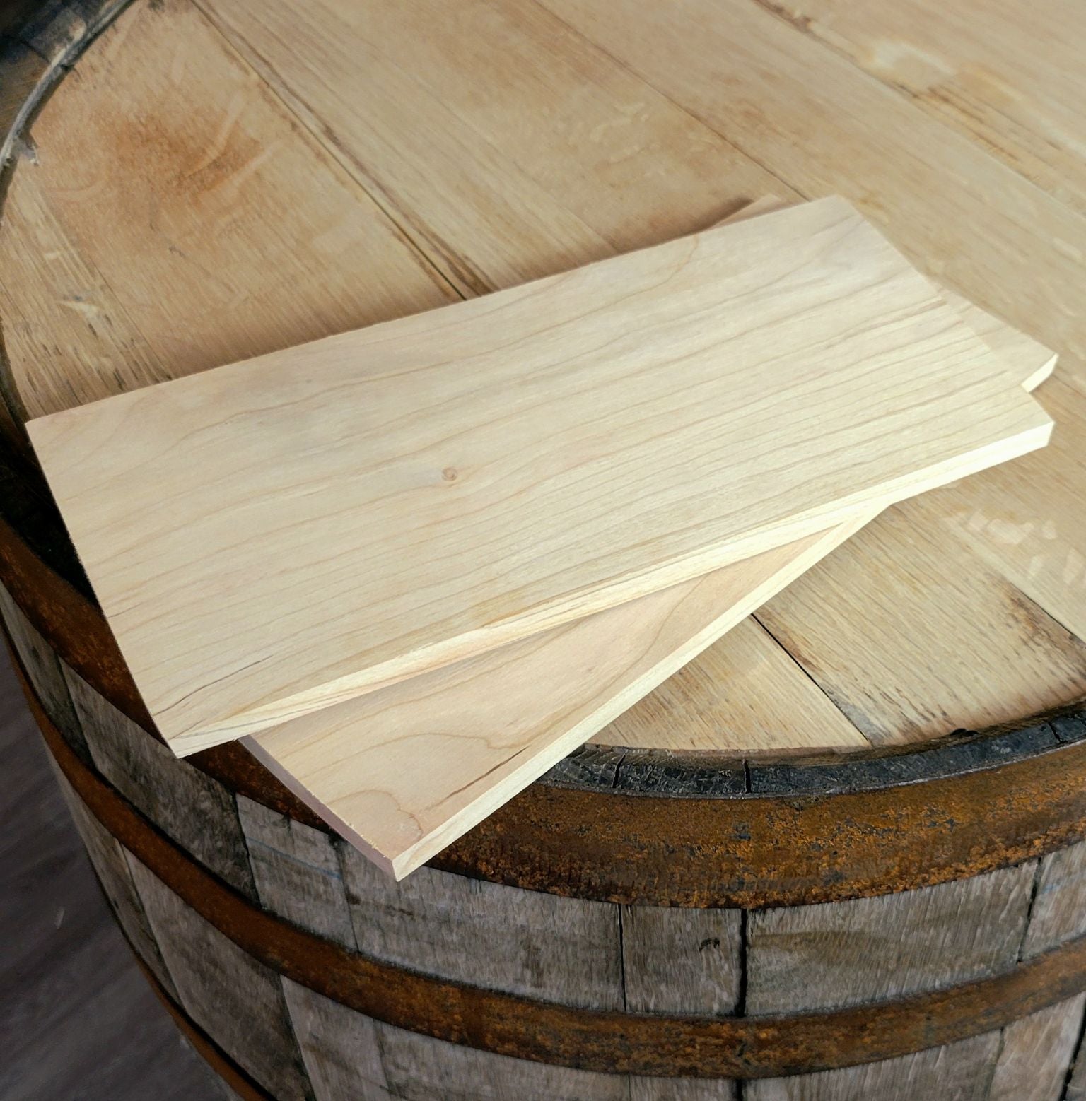 A pack of 30 cedar grilling planks, each measuring 5x11 inches, showcasing their natural wood texture and imperfections.