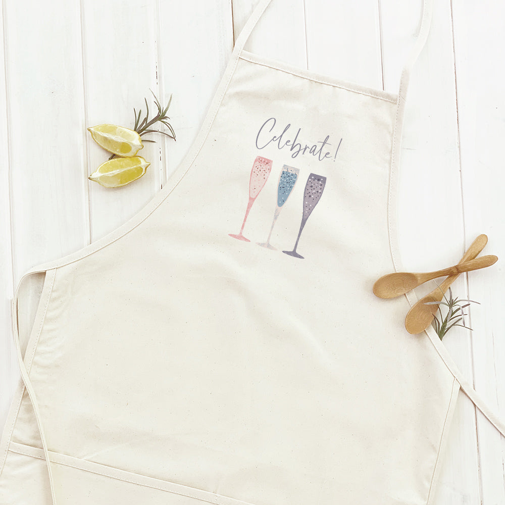 Celebrate Champagne Women's Apron featuring elegant design, adjustable neck, and divided front pocket, made from durable cotton canvas.