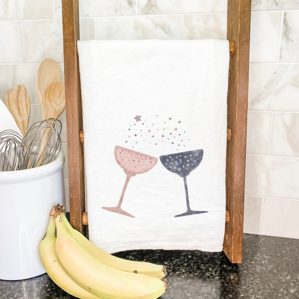 Champagne Toast Cotton Tea Towel featuring vibrant design and hemmed edges, perfect for kitchen use.