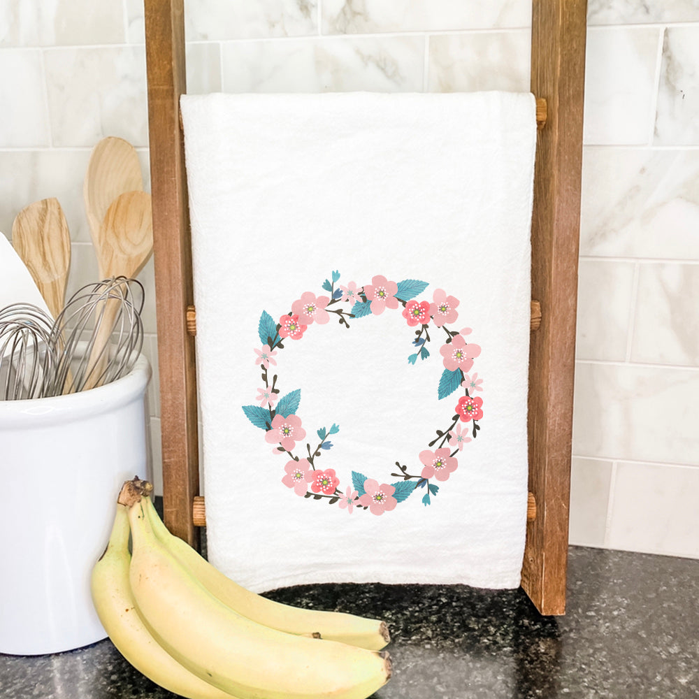 Cherry Blossom Wreath cotton tea towel featuring vibrant floral design, hemmed edges, and absorbent fabric.