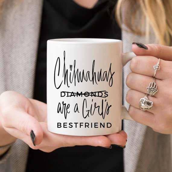 A humorous coffee mug featuring a Chihuahua design with the phrase 'Chihuahuas Are A Girl's Best Friend', crafted from high-quality ceramic.