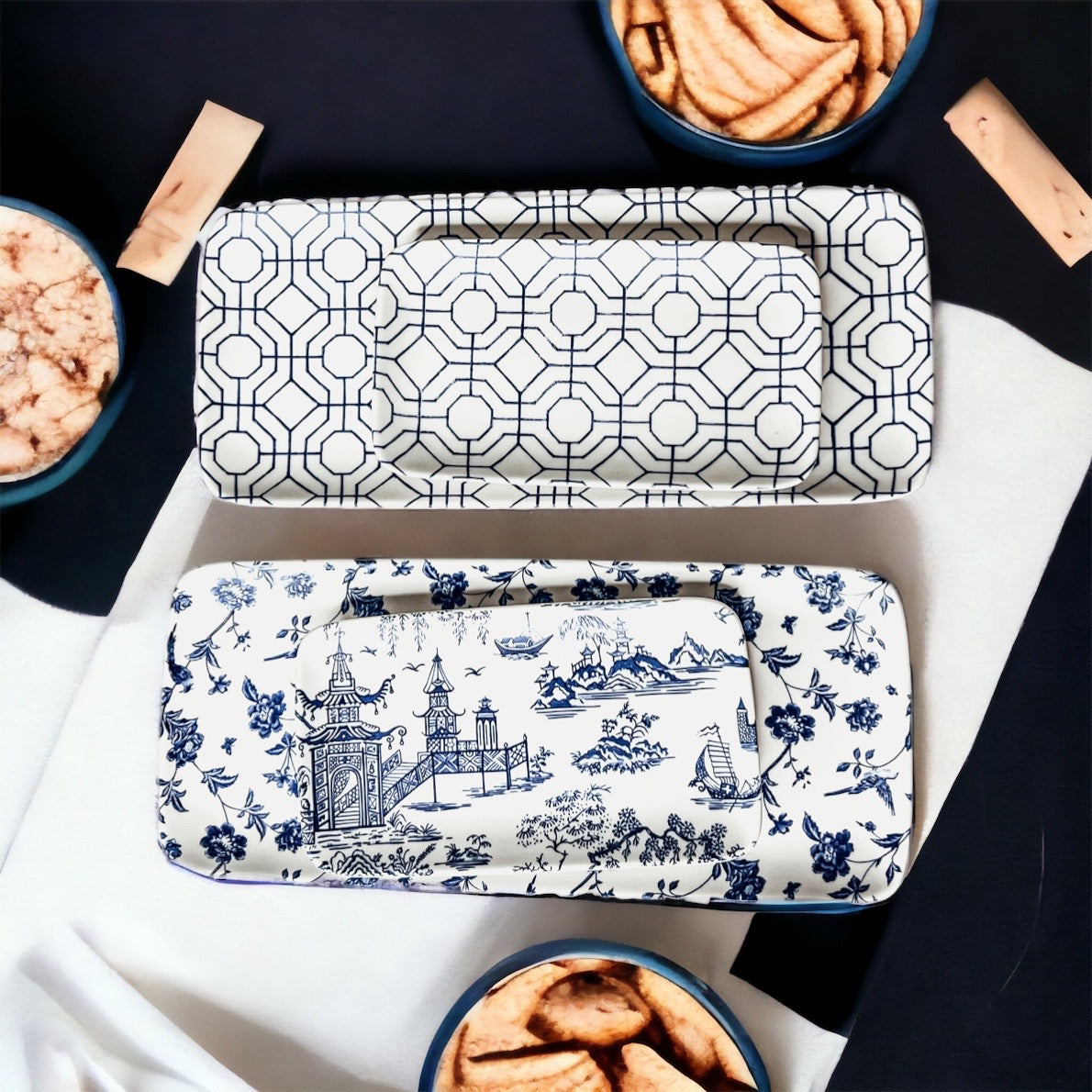 Chinoiserie Serving Set featuring 4 pieces with blue and white patterns, including serving and tidbit trays.