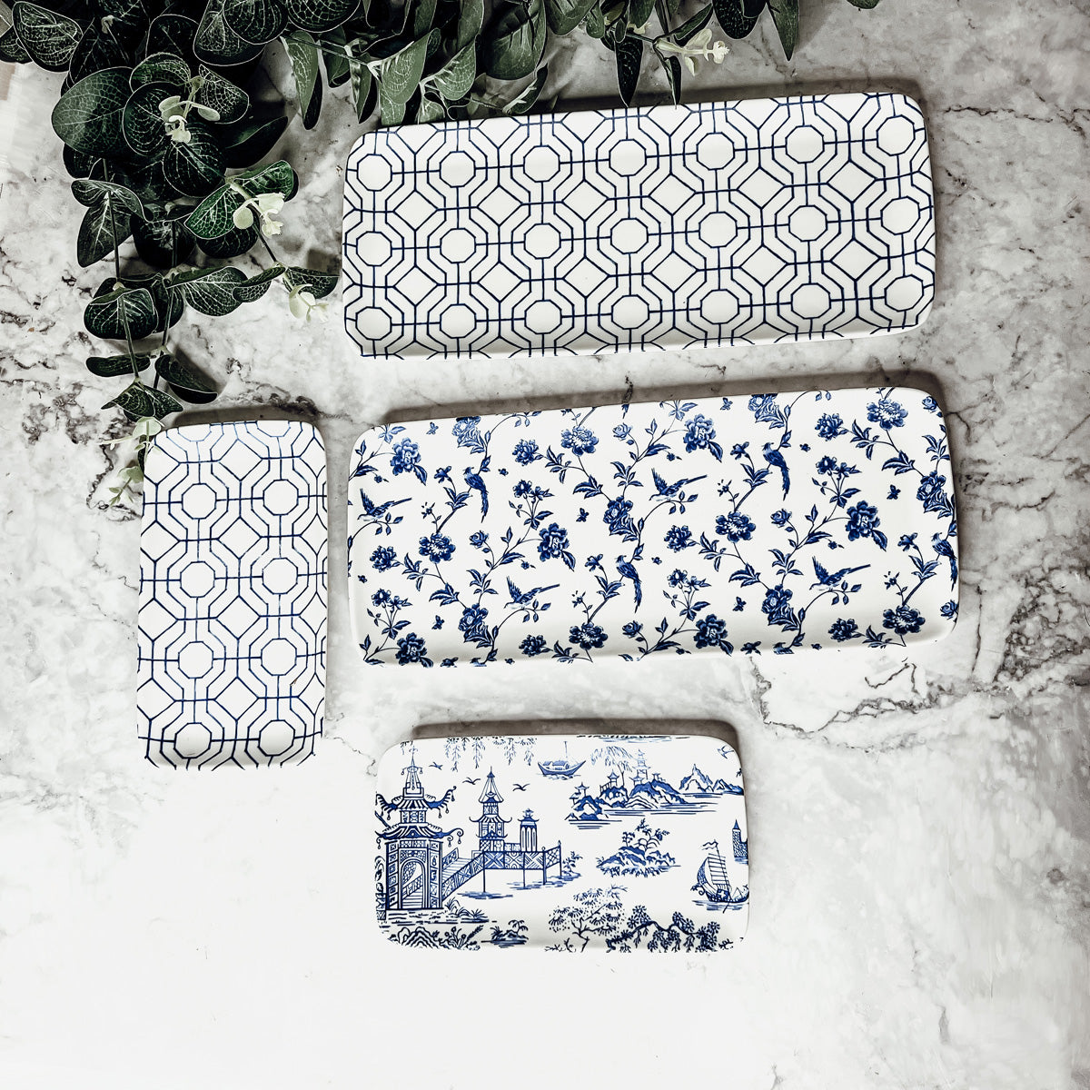 Chinoiserie Serving Set featuring 4 pieces with blue and white patterns, including serving and tidbit trays.