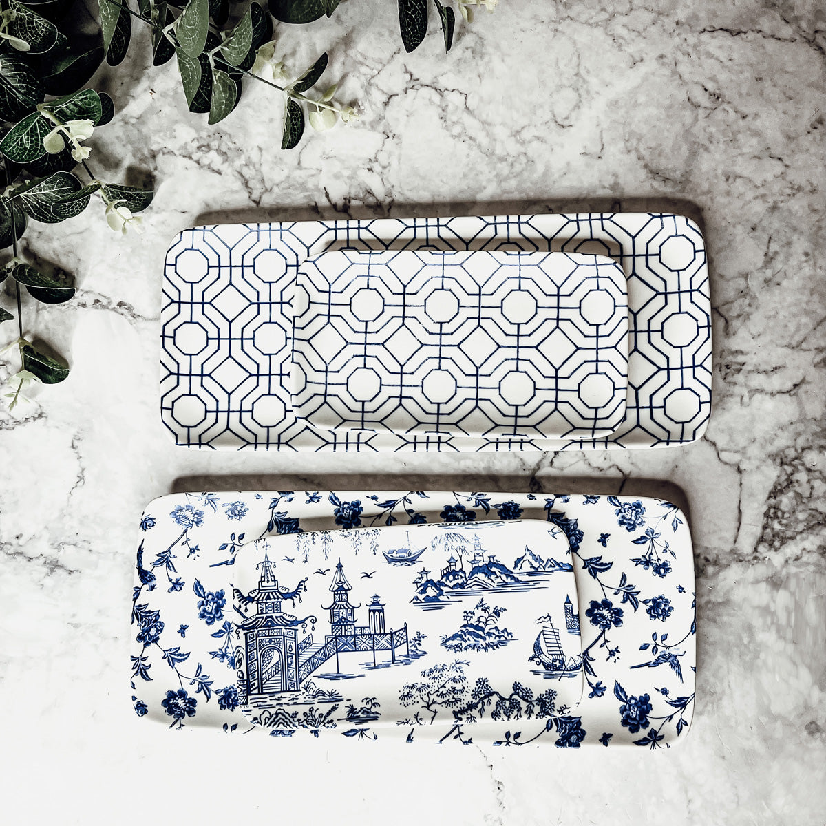 Chinoiserie Serving Set featuring 4 pieces with blue and white patterns, including serving and tidbit trays.