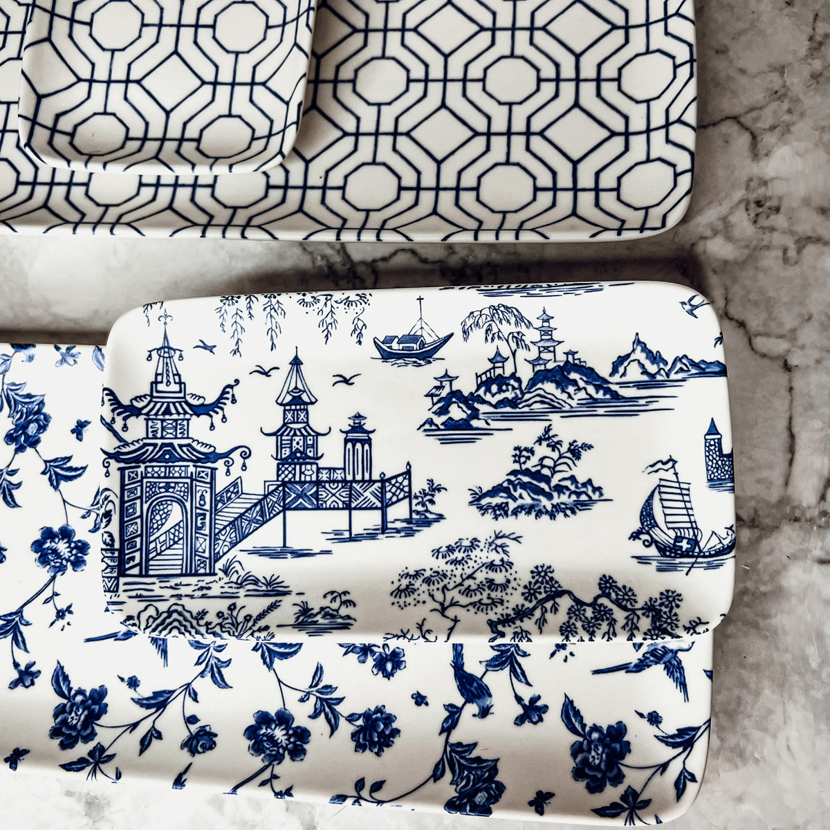 Chinoiserie Serving Set featuring 4 pieces with blue and white patterns, including serving and tidbit trays.