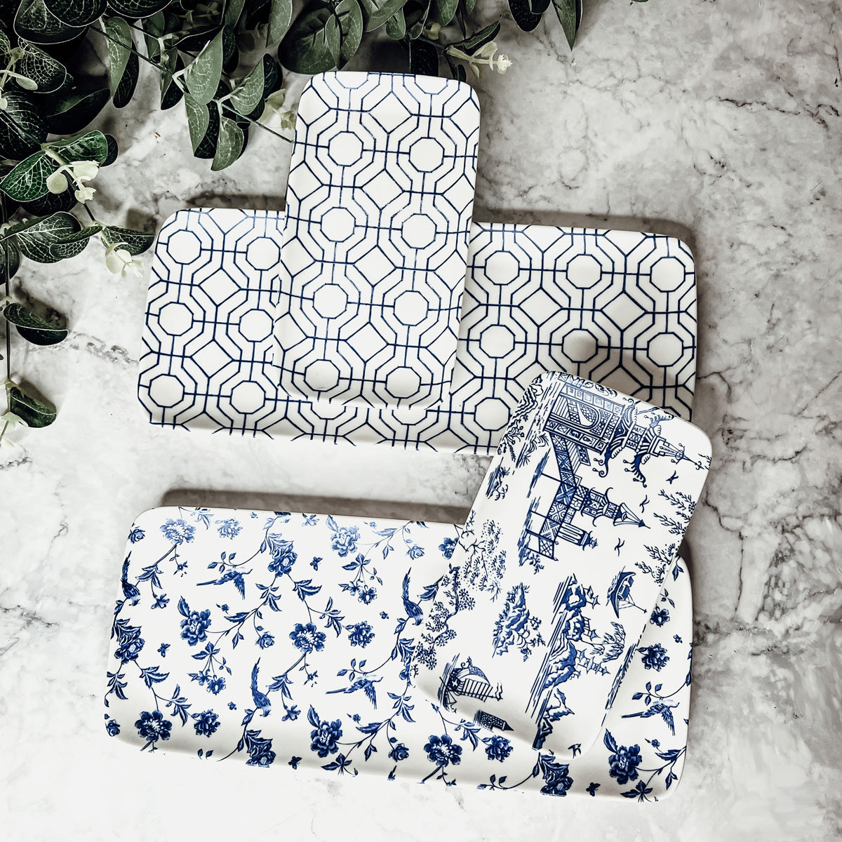 Chinoiserie Serving Set featuring 4 pieces with blue and white patterns, including serving and tidbit trays.