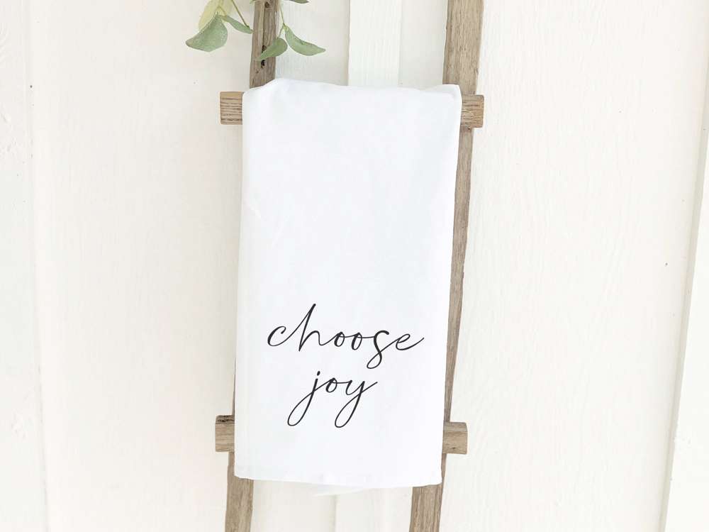 Choose Joy cotton tea towel featuring vibrant designs, made from 100% absorbent cotton, perfect for kitchen use.