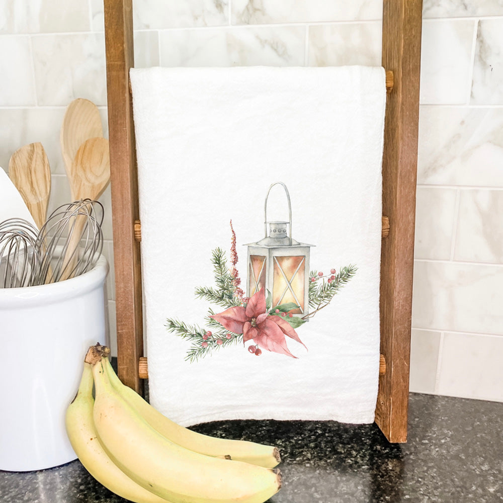 A beautifully designed Christmas Lantern cotton tea towel featuring vibrant colors and hemmed edges, perfect for holiday kitchens.