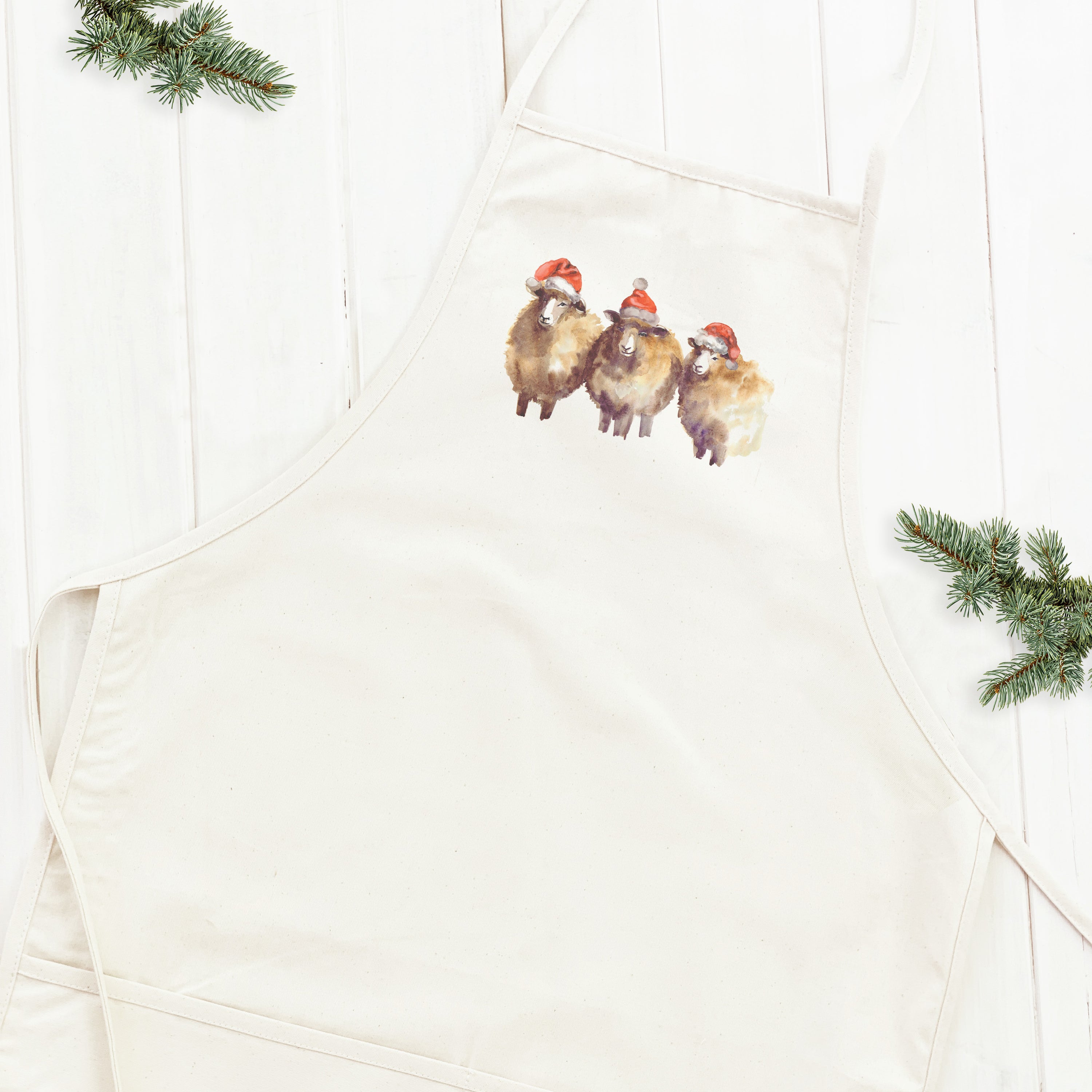 A stylish Christmas Sheep Women's Apron featuring a whimsical sheep design, made from durable cotton canvas with adjustable neck and twill ties.