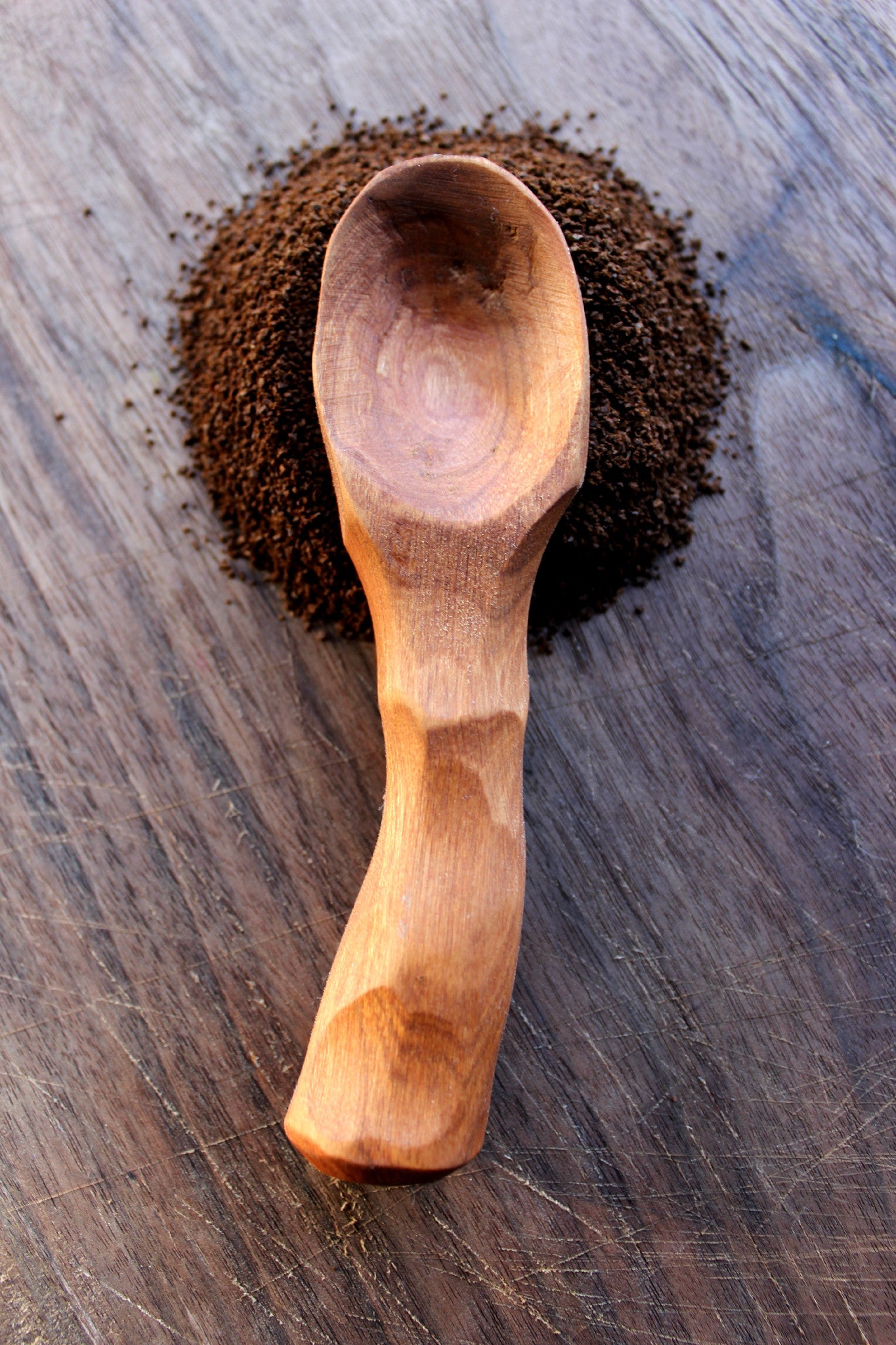 A beautifully crafted Coffee Scoop made from urban Cherry or Walnut wood, showcasing its natural grain and food-safe olive oil finish.