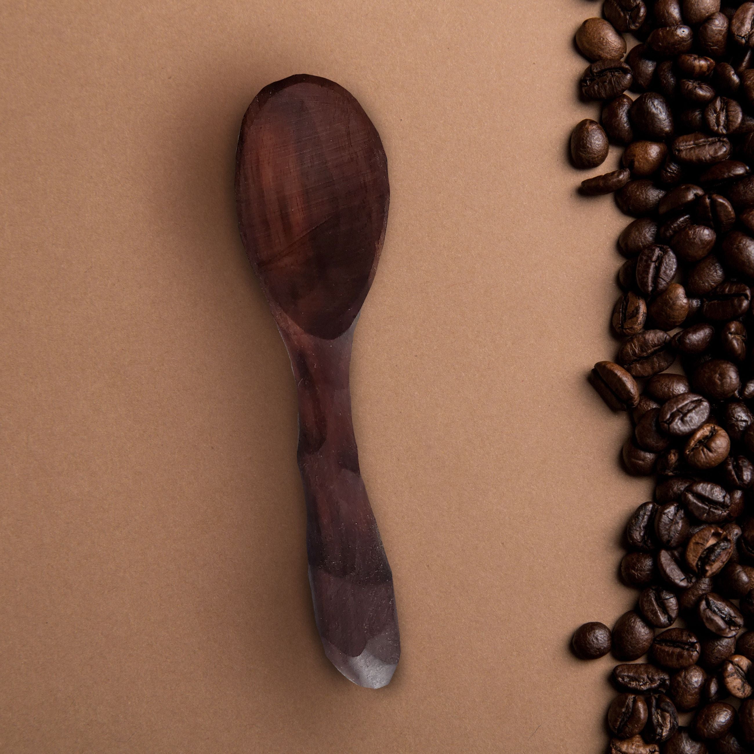 A beautifully crafted Coffee Scoop made from urban Cherry or Walnut wood, showcasing its natural grain and food-safe olive oil finish.