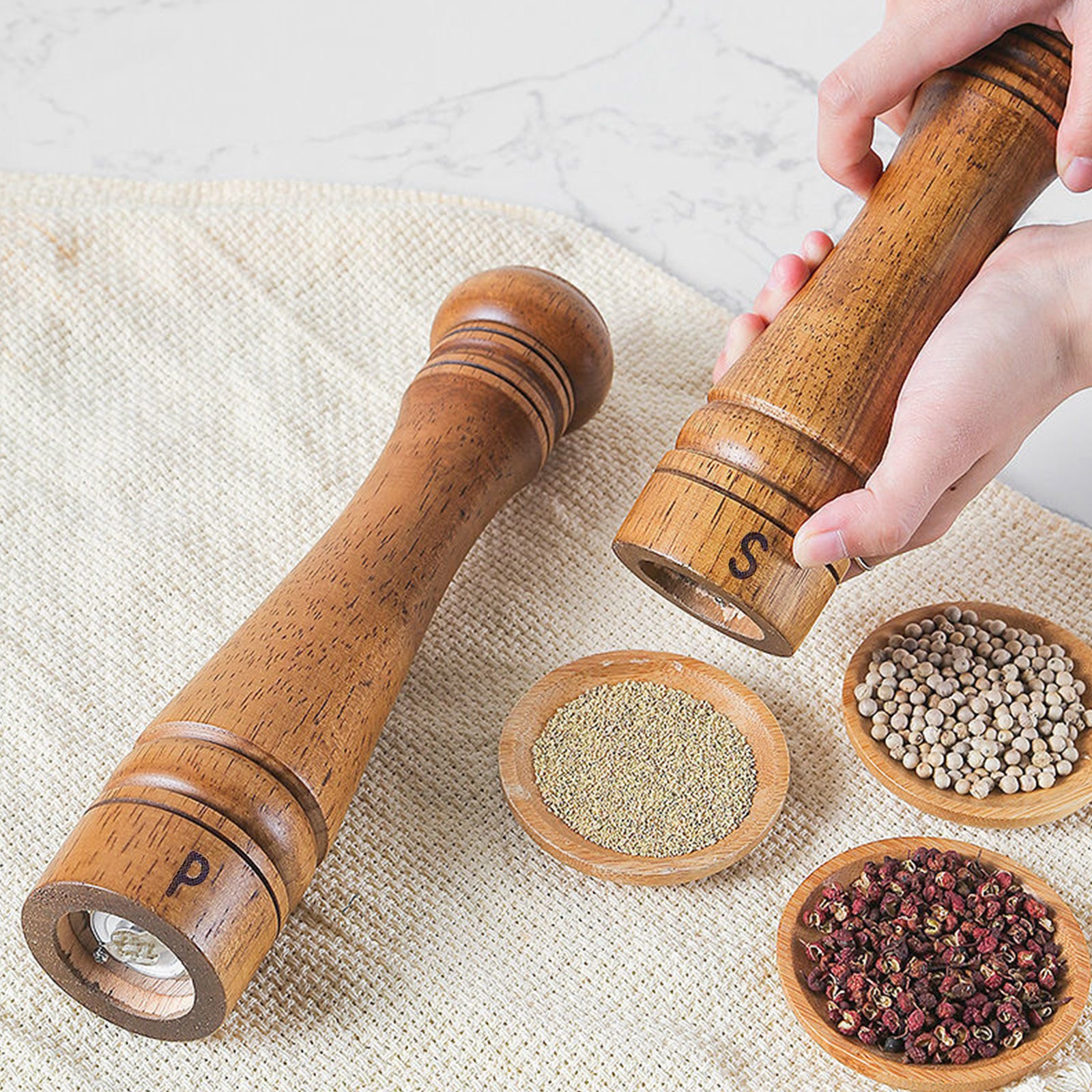 Wooden salt and pepper grinder with adjustable settings, showcasing its elegant design and eco-friendly materials.