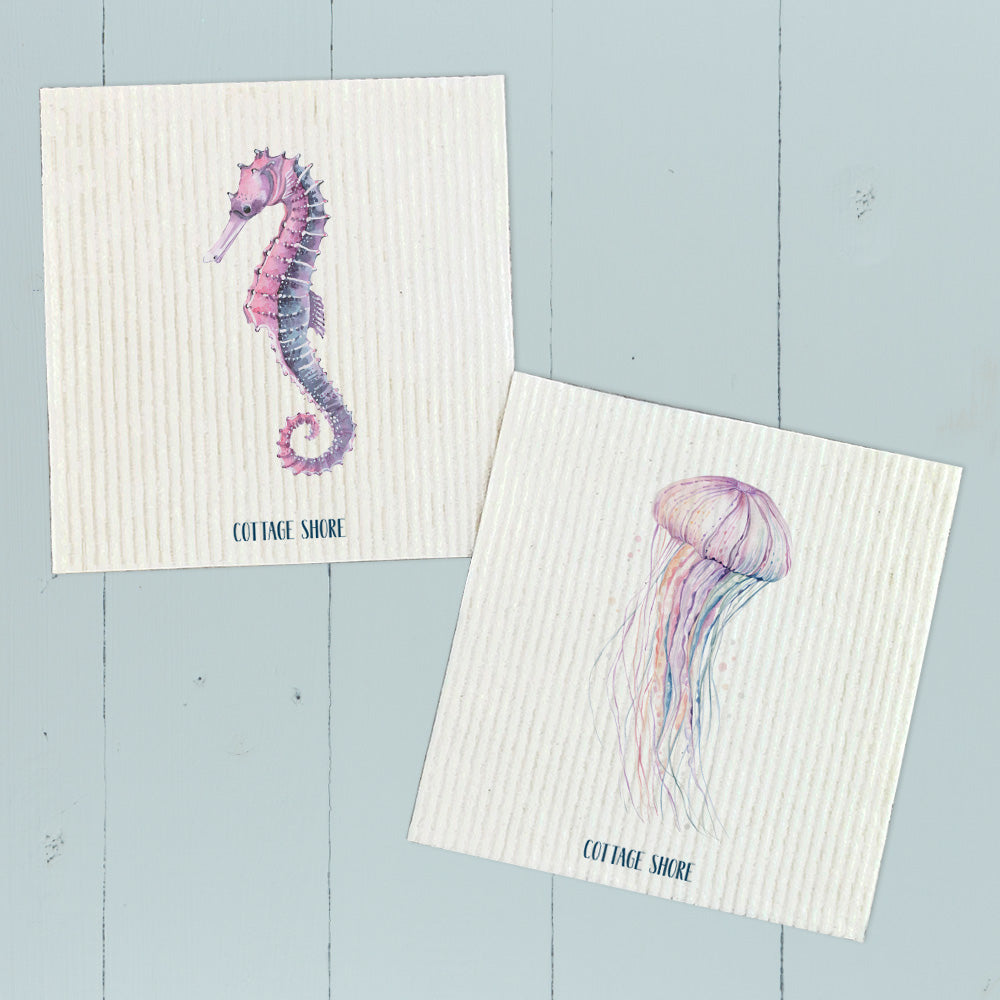 Colorful Swedish dish cloths featuring seahorse and jellyfish designs, eco-friendly and reusable.