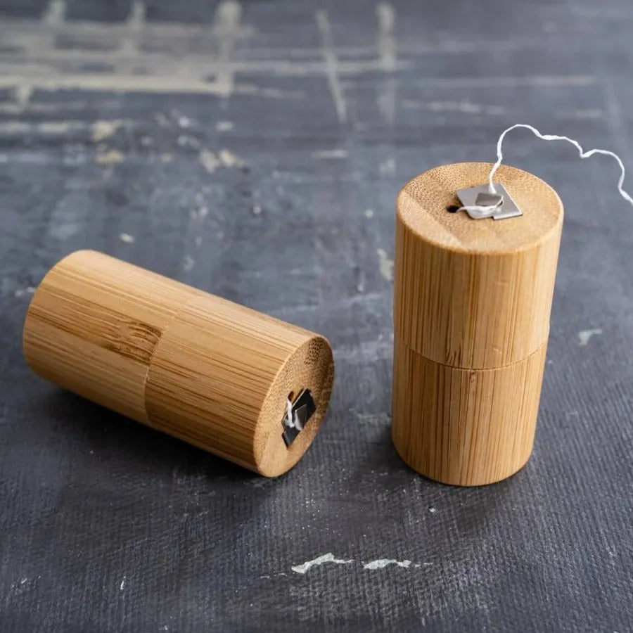 Corn Starch Dental Floss in a bamboo case, showcasing its eco-friendly design and sustainable materials.