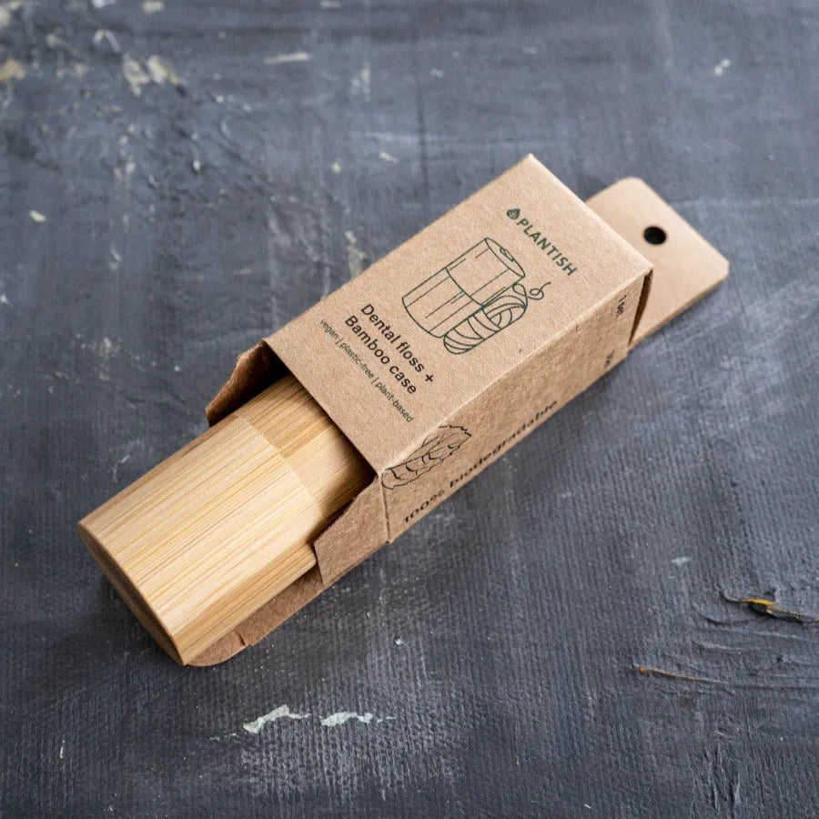 Corn Starch Dental Floss in a bamboo case, showcasing its eco-friendly design and sustainable materials.