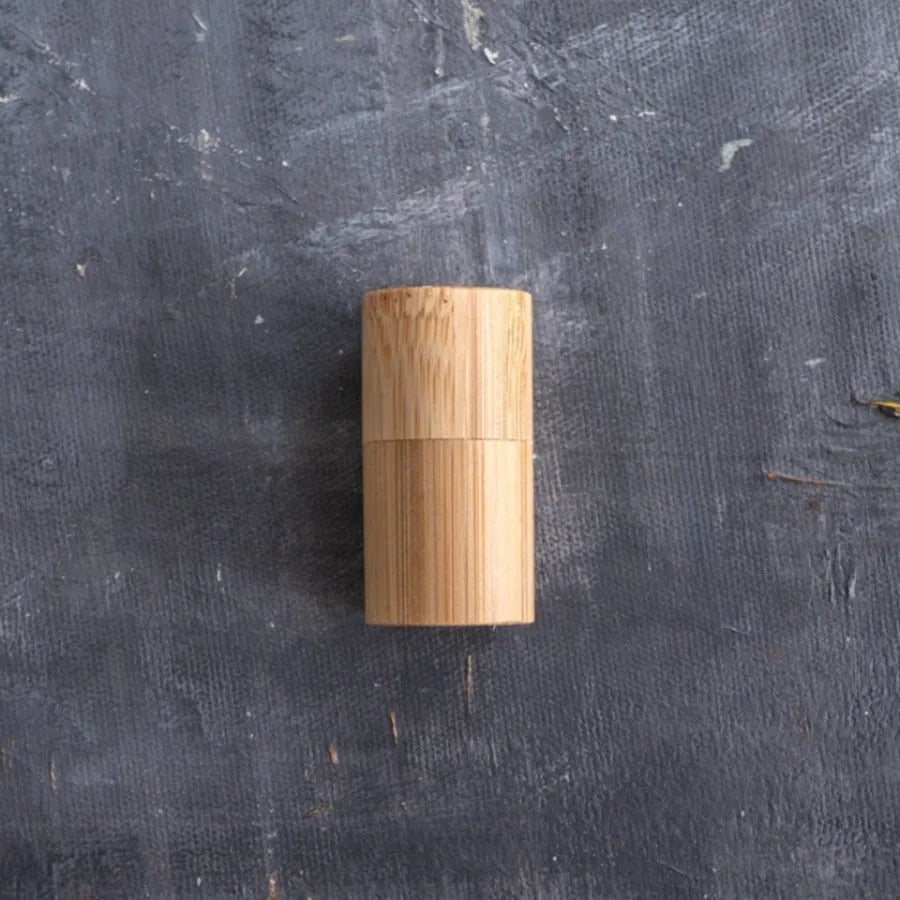 Corn Starch Dental Floss in a bamboo case, showcasing its eco-friendly design and sustainable materials.