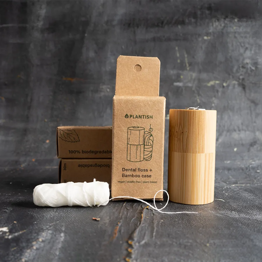 Corn Starch Dental Floss in a bamboo case, showcasing its eco-friendly design and sustainable materials.