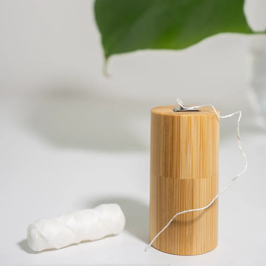 Corn Starch Dental Floss in a bamboo case, showcasing its eco-friendly design and sustainable materials.