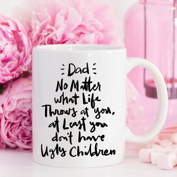 Funny coffee mug for dads with humorous text about parenting, made of high-quality ceramic.