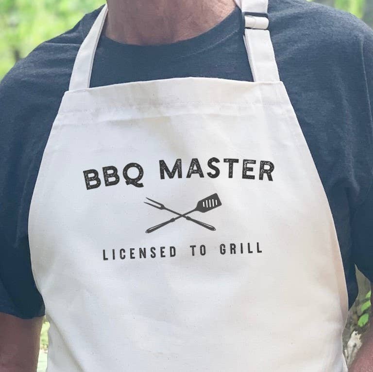 Dad's BBQ Master Licensed to Grill apron made of durable cotton canvas with adjustable neck and twill ties, featuring a vibrant printed design.