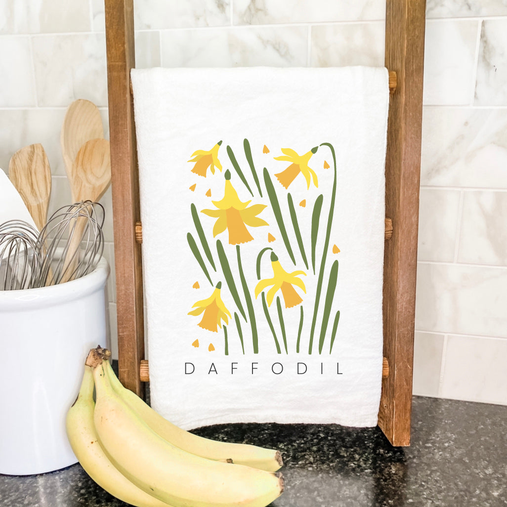 Daffodil Cotton Tea Towel featuring vibrant floral design, made from 100% absorbent cotton, perfect for kitchen use.