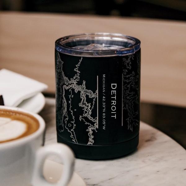 Matte black insulated cup featuring a custom engraved map of Detroit, Michigan with coordinates.