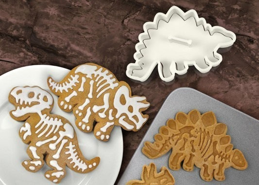 Dinosaur Biscuit Mould featuring three dinosaur shapes: Stegosaurus, Tyrannosaurus Rex, and Triceratops, made from food-grade PVC material.