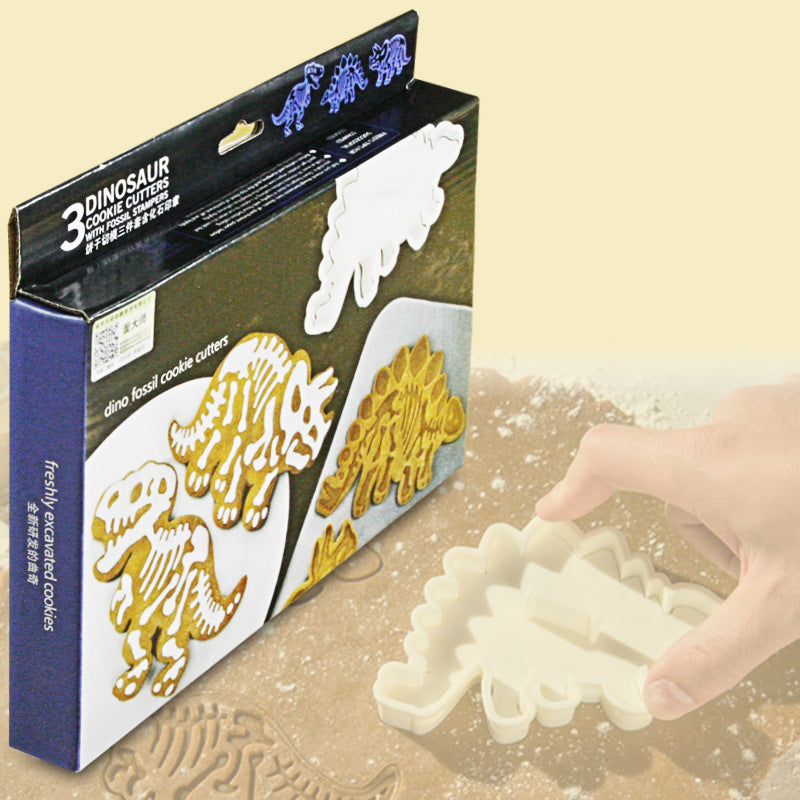 Dinosaur Biscuit Mould featuring three dinosaur shapes: Stegosaurus, Tyrannosaurus Rex, and Triceratops, made from food-grade PVC material.