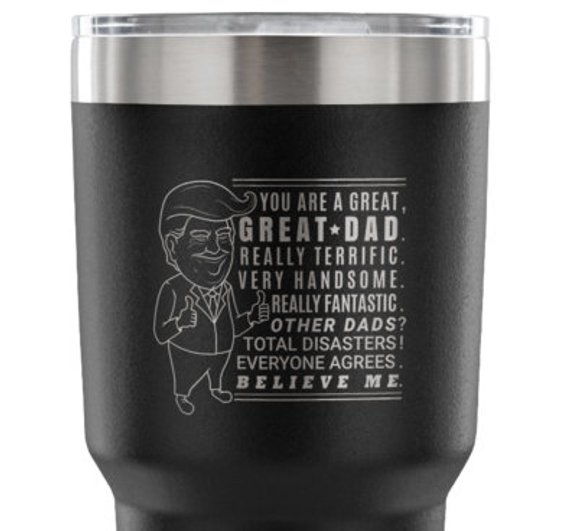 Black tumbler with engraved text.