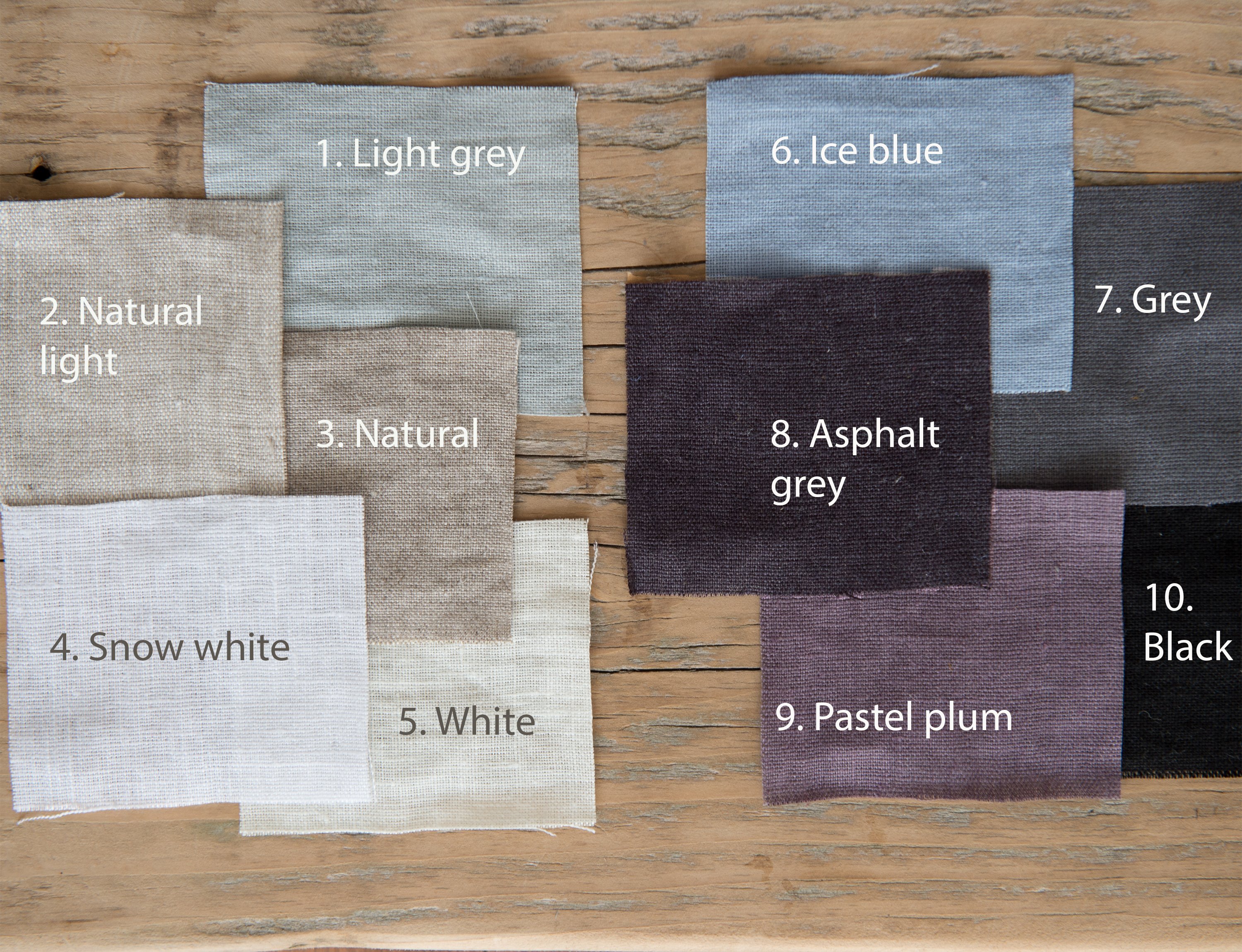 Set of double-sided linen napkins in various colors, showcasing their unique design and soft texture.