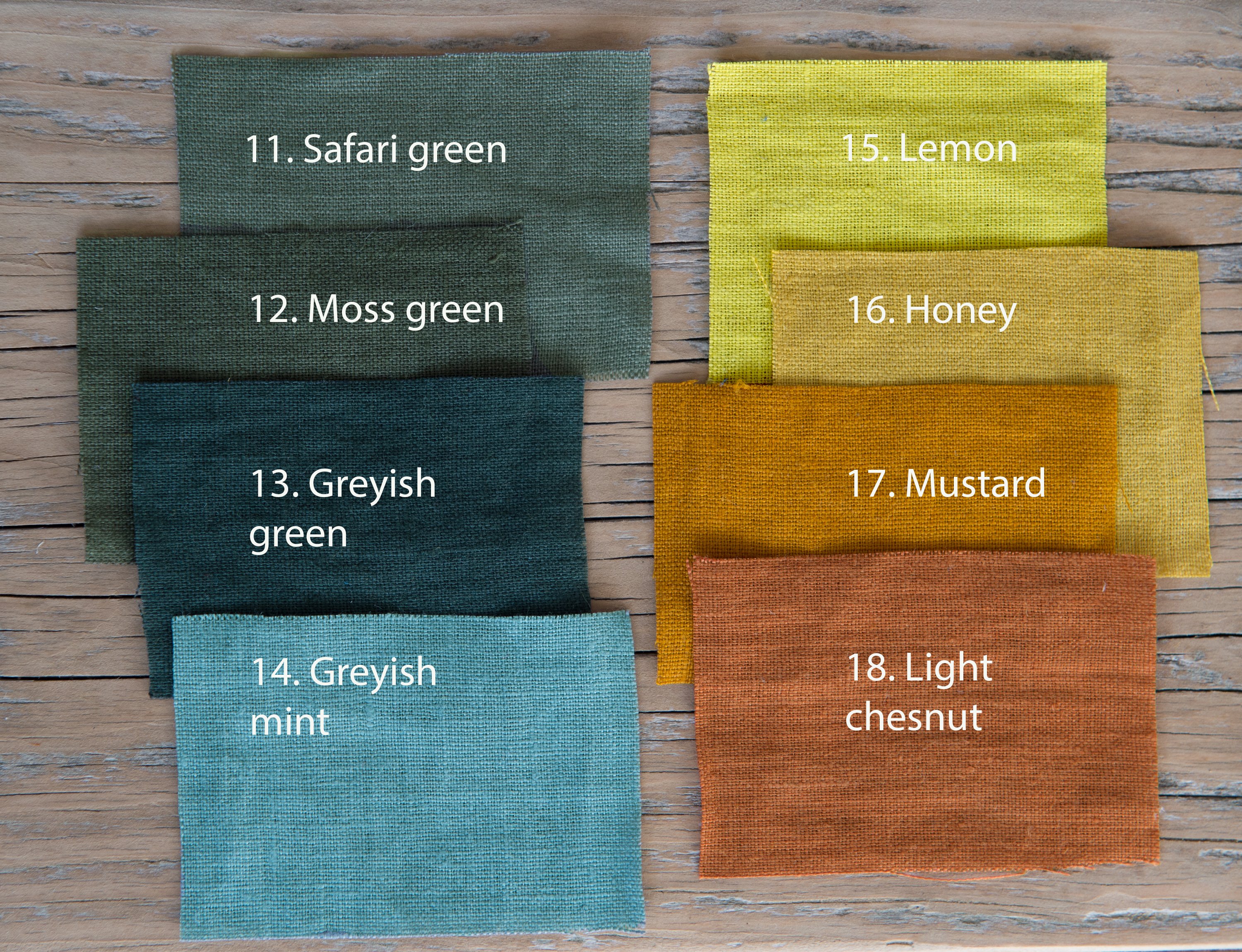 Set of double-sided linen napkins in various colors, showcasing their unique design and soft texture.