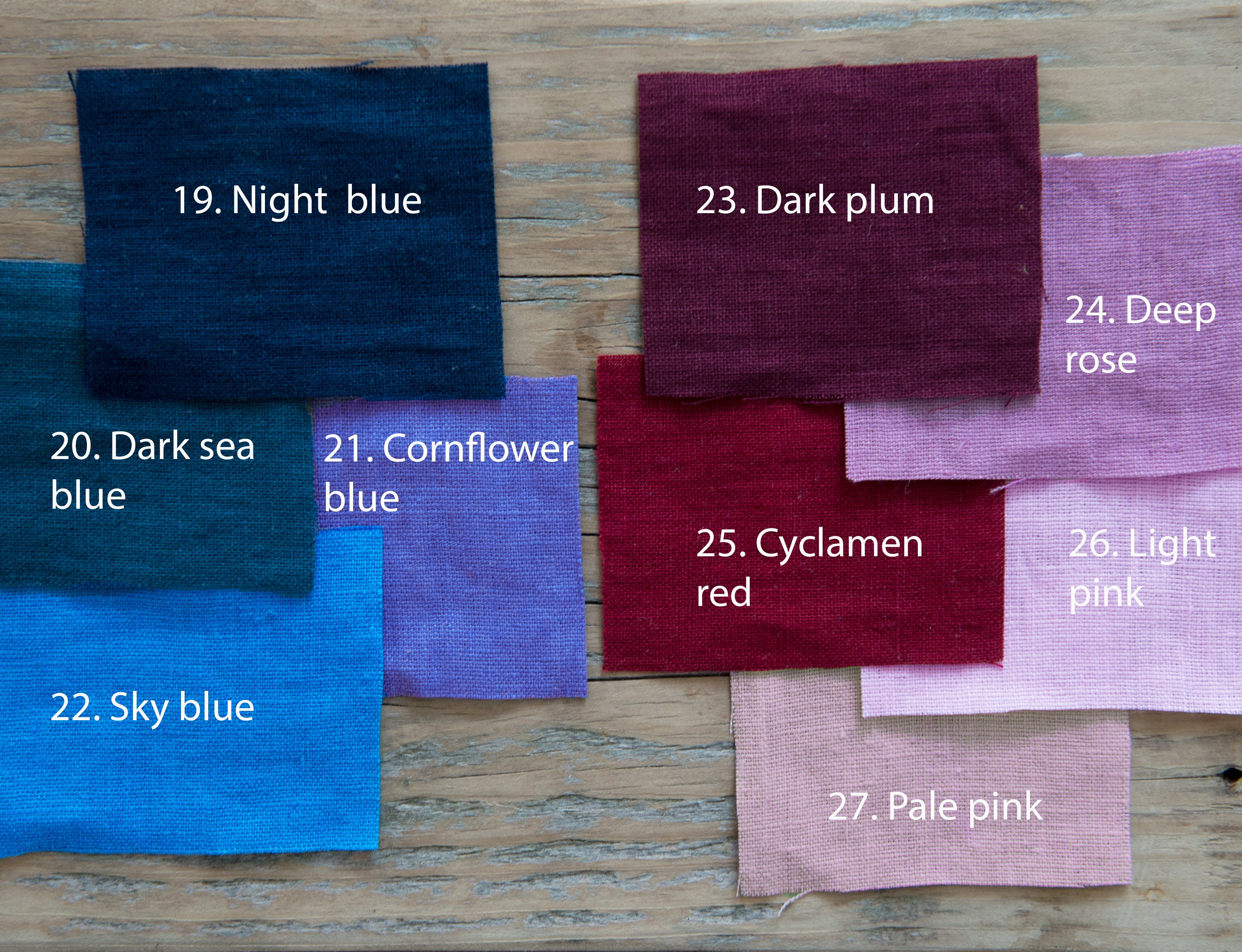 Set of double-sided linen napkins in various colors, showcasing their unique design and soft texture.