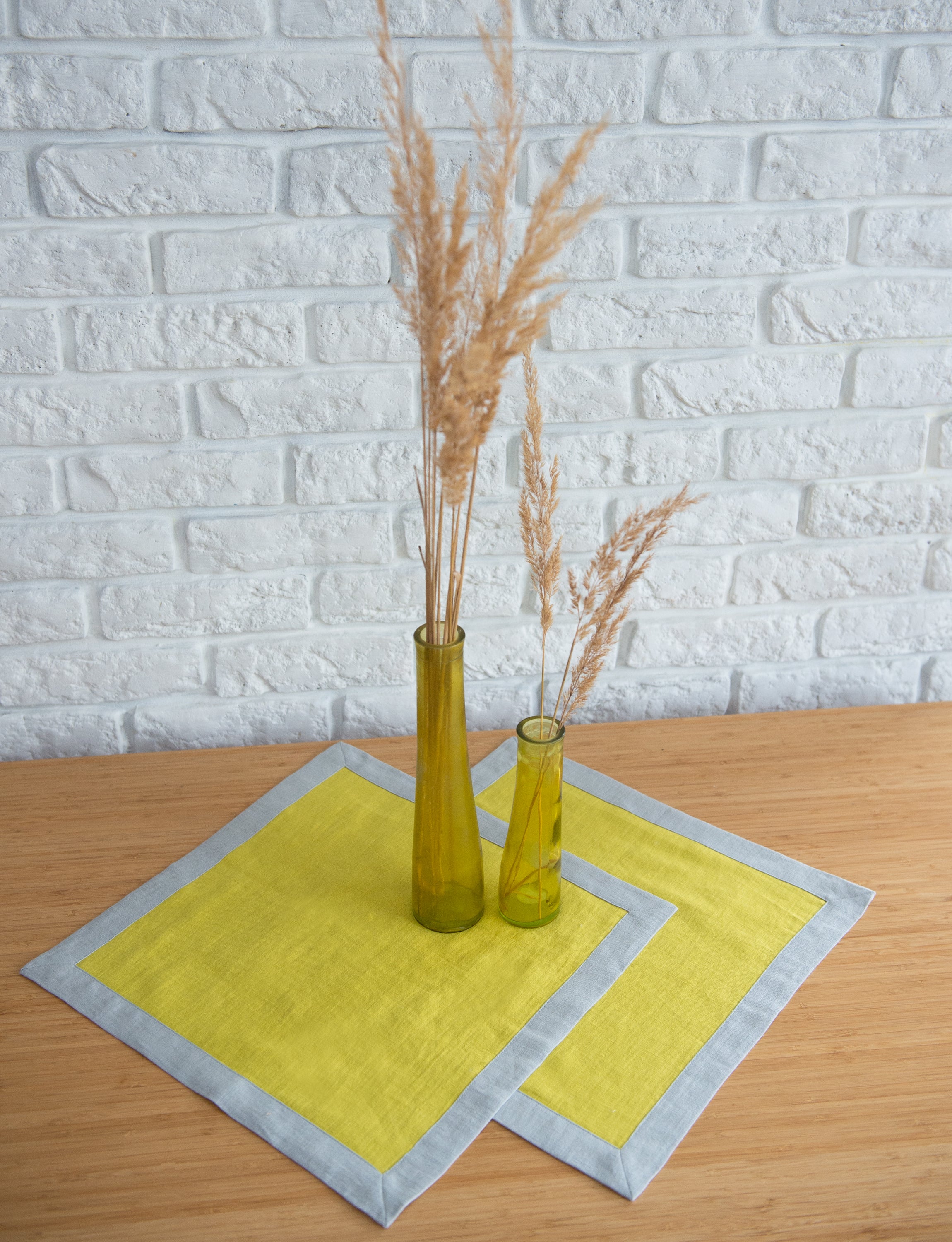 Set of double-sided linen napkins in various colors, showcasing their unique design and soft texture.