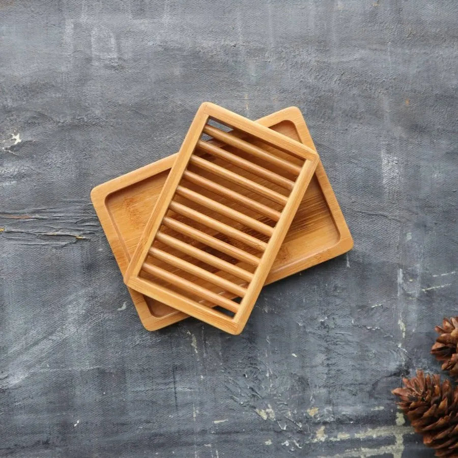 A stylish dual-layer bamboo soap dish with a drying rack and draining tray, designed for eco-friendly living.