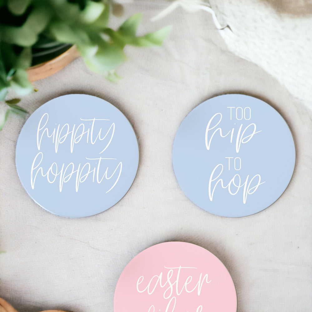 A set of colorful ceramic coasters featuring Easter and spring designs, showcasing a matte finish and cork backing for protection.