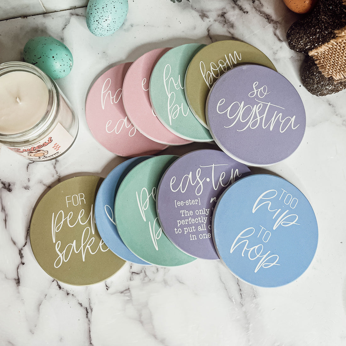 A set of colorful ceramic coasters featuring Easter and spring designs, showcasing a matte finish and cork backing for protection.